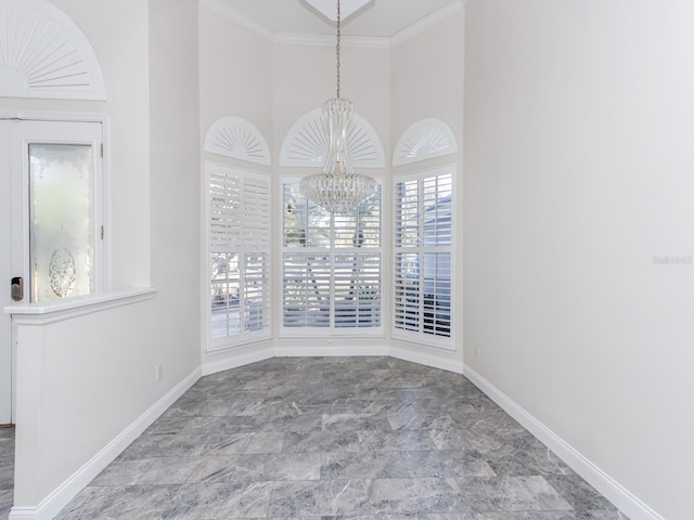 empty room with a notable chandelier, a towering ceiling, and a wealth of natural light