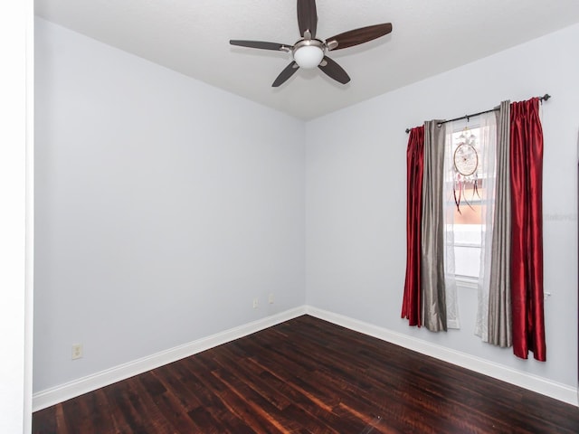 spare room featuring hardwood / wood-style flooring and ceiling fan