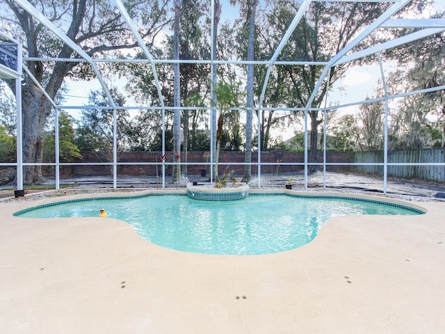 view of pool with a lanai and a patio