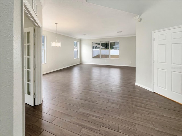 unfurnished room featuring crown molding