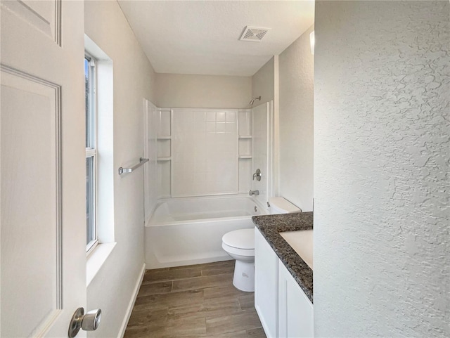 full bathroom with vanity, bathing tub / shower combination, and toilet