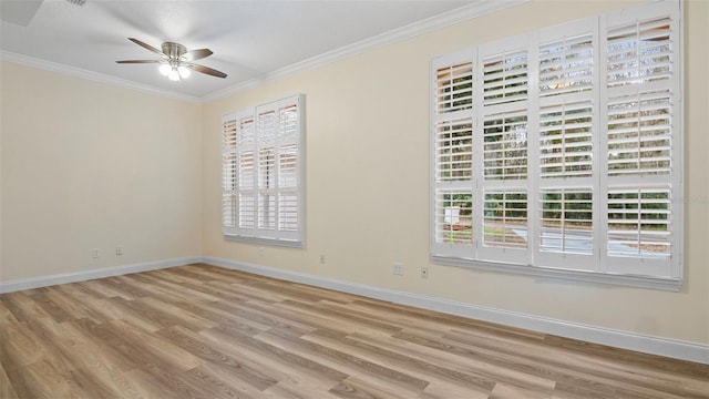 empty room with ceiling fan, ornamental molding, and light wood-type flooring