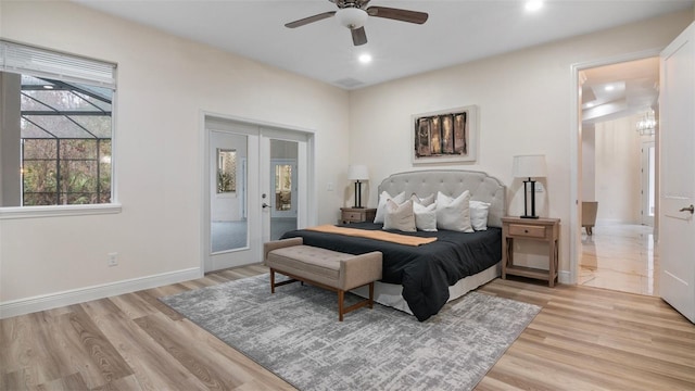 bedroom with access to exterior, light hardwood / wood-style flooring, french doors, and ceiling fan