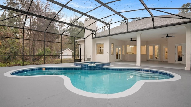 view of swimming pool featuring a lanai, a patio, ceiling fan, and an in ground hot tub