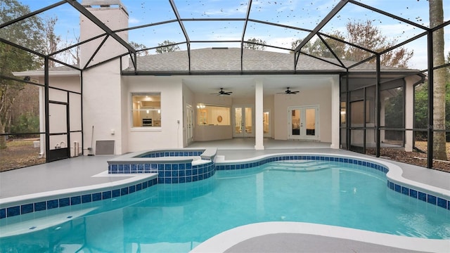 view of pool with a lanai, ceiling fan, and an in ground hot tub