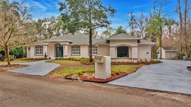 view of front of house with a storage shed