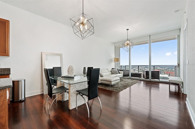 dining room featuring dark wood-type flooring and a chandelier