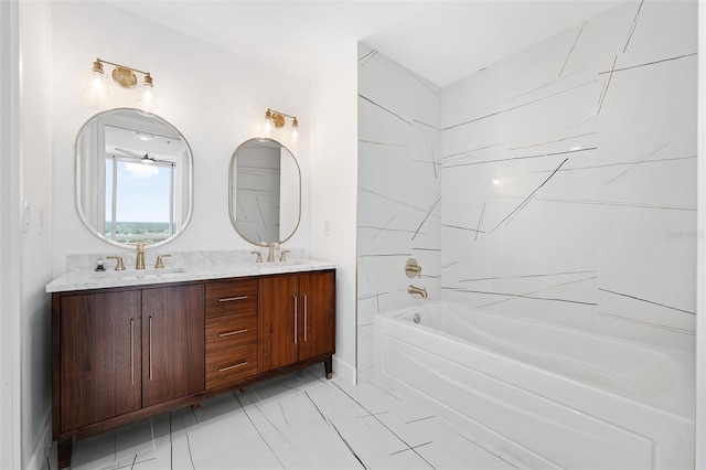 bathroom featuring vanity and a bath