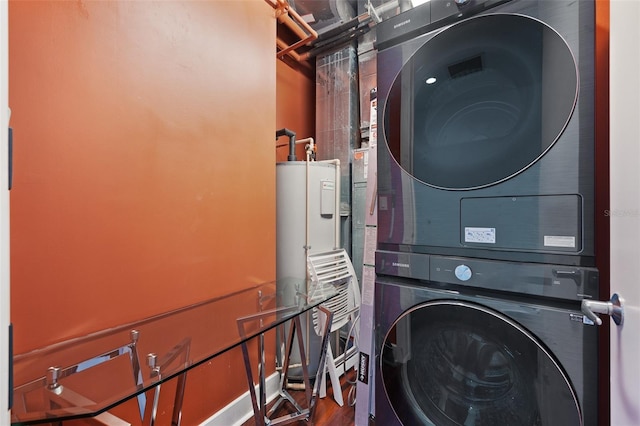 clothes washing area featuring stacked washer and dryer