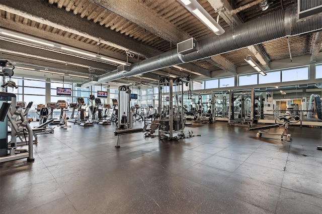 workout area featuring a high ceiling