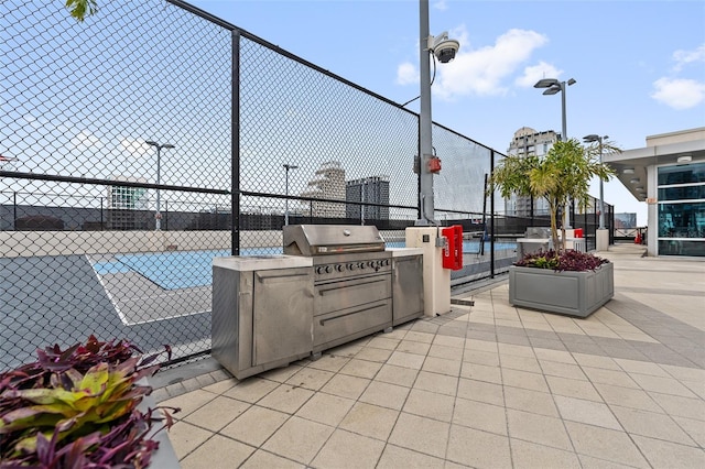 view of patio with an outdoor kitchen and area for grilling