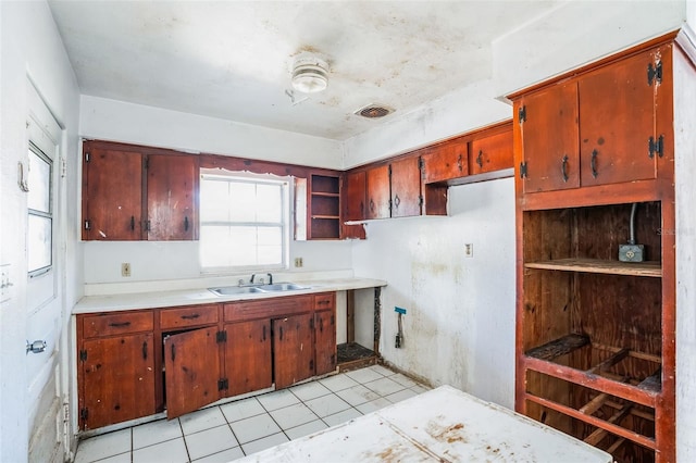 kitchen with sink and light tile patterned floors