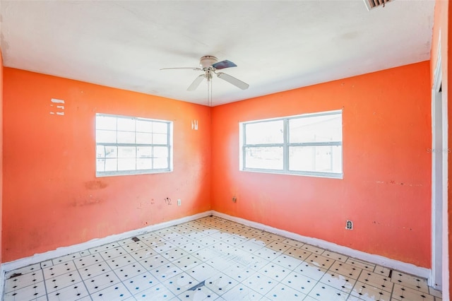 unfurnished room with ceiling fan