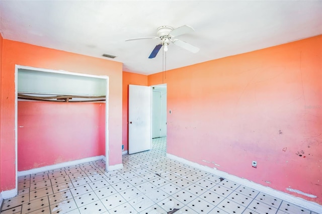 unfurnished bedroom featuring a closet and ceiling fan