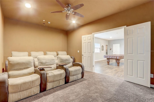 home theater with light carpet and ceiling fan