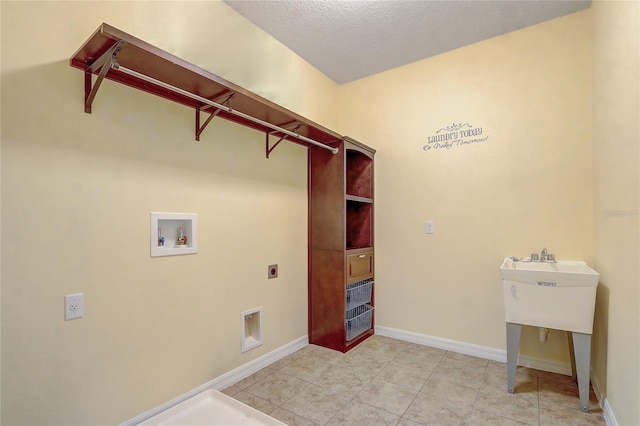 washroom featuring washer hookup, light tile patterned flooring, and electric dryer hookup