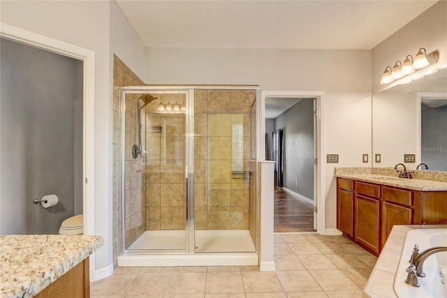 full bathroom with toilet, separate shower and tub, tile patterned flooring, and vanity