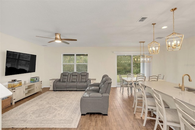 living room with sink and ceiling fan