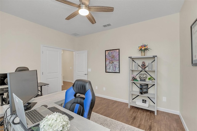 office space featuring hardwood / wood-style floors and ceiling fan