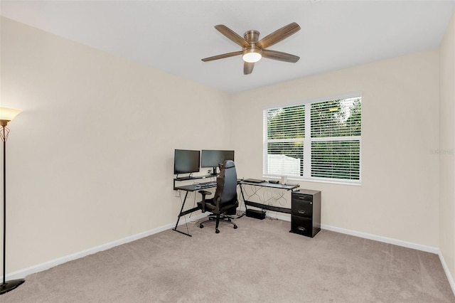 carpeted home office with ceiling fan