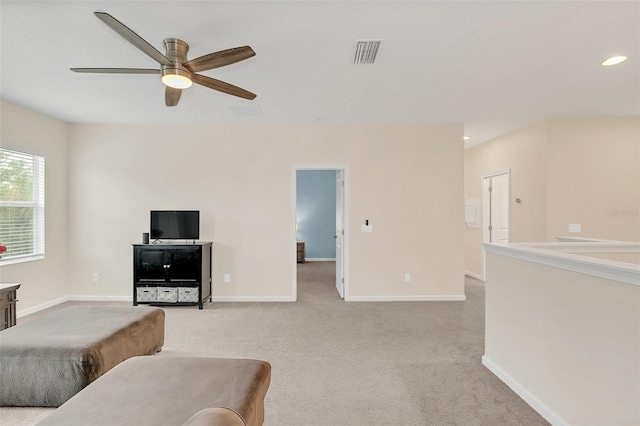 living room featuring light colored carpet and ceiling fan