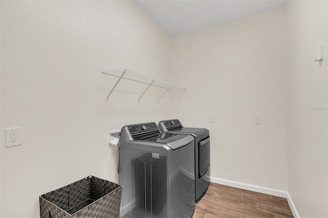 laundry area featuring washing machine and clothes dryer