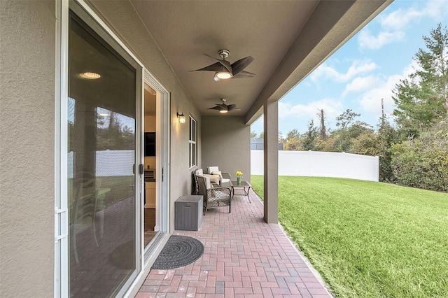 view of patio featuring ceiling fan