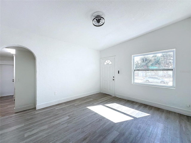 interior space with dark hardwood / wood-style floors and a textured ceiling