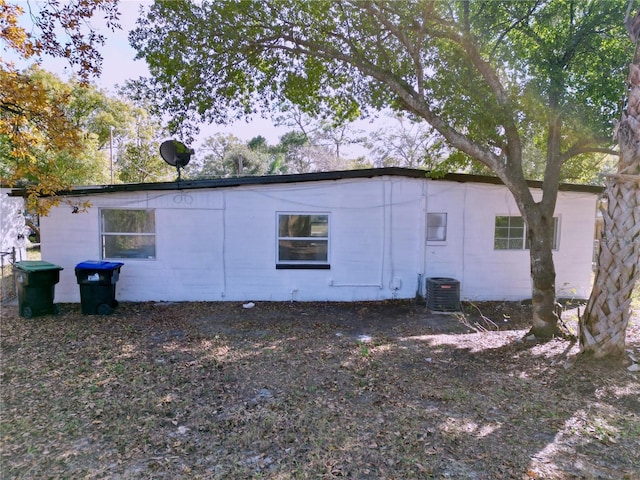 rear view of property featuring central air condition unit