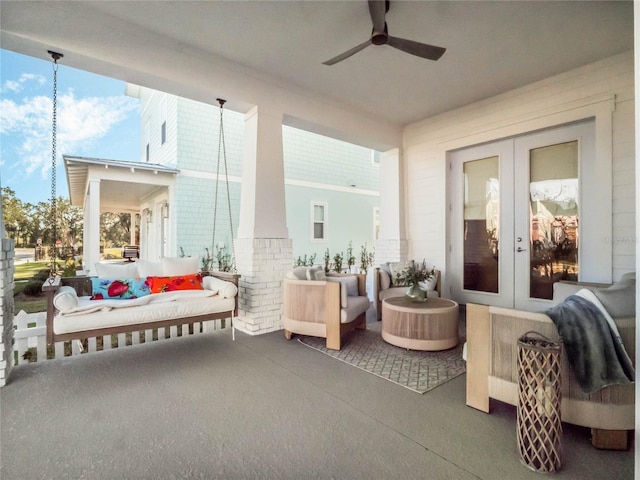 sunroom with ceiling fan and french doors