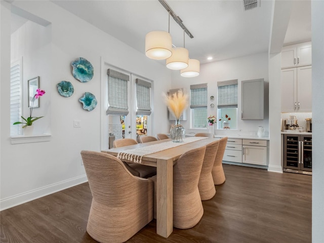 dining space with wine cooler, dark hardwood / wood-style flooring, and french doors