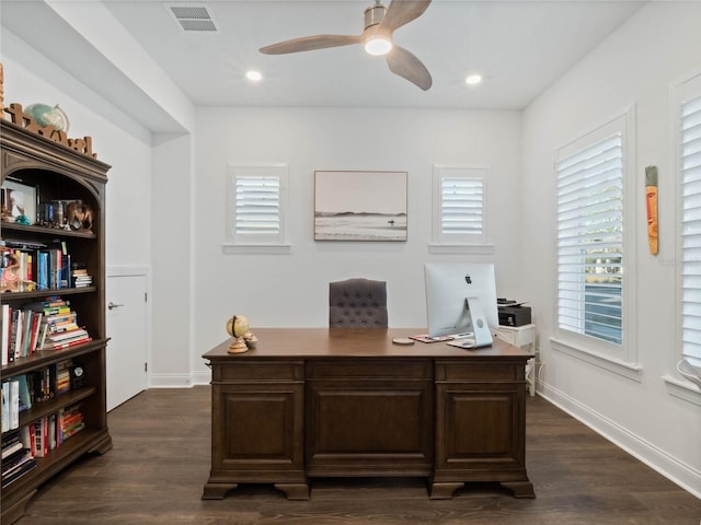 office space featuring ceiling fan and dark hardwood / wood-style flooring