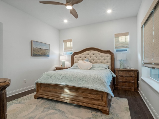 bedroom with ceiling fan and dark hardwood / wood-style floors