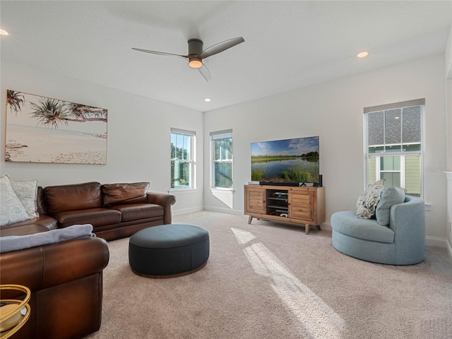 living room with carpet and ceiling fan