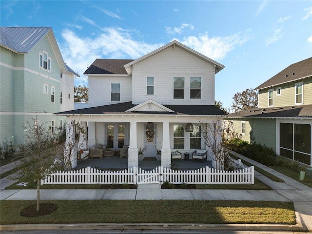 view of front facade featuring french doors and a porch