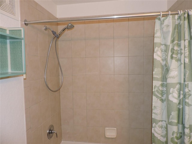 bathroom with shower / bath combination with curtain