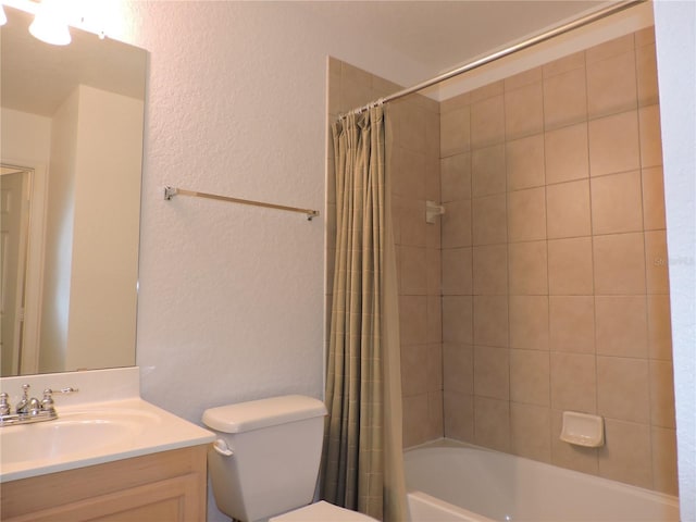 full bathroom featuring shower / bathtub combination with curtain, vanity, and toilet