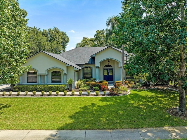 ranch-style house featuring a front yard