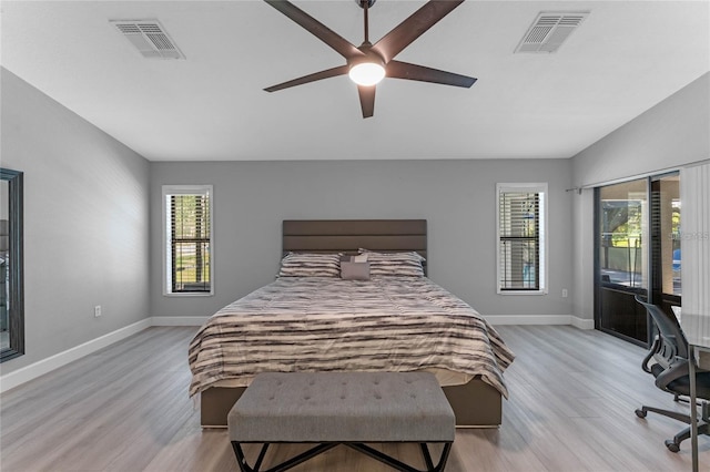 bedroom with ceiling fan and light hardwood / wood-style floors