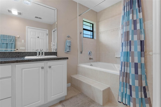 bathroom featuring vanity, shower / tub combo, and tile patterned floors