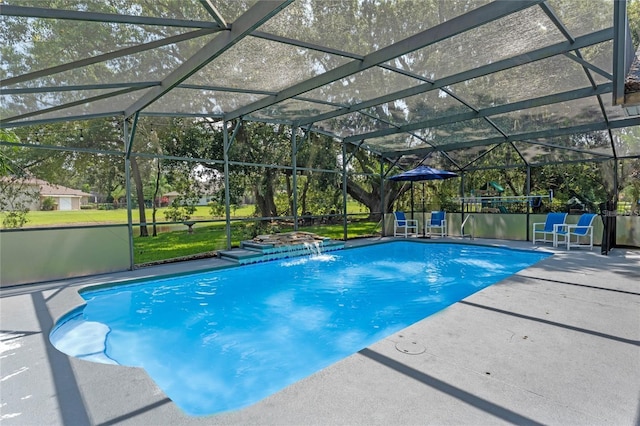 view of swimming pool featuring a yard, a patio area, pool water feature, and glass enclosure