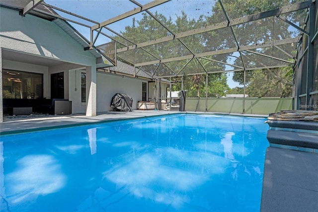 view of pool featuring a lanai and a patio area