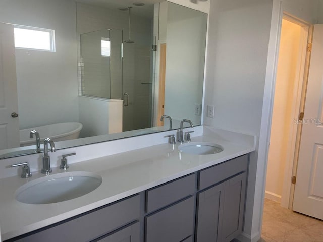 bathroom featuring vanity, separate shower and tub, and tile patterned floors