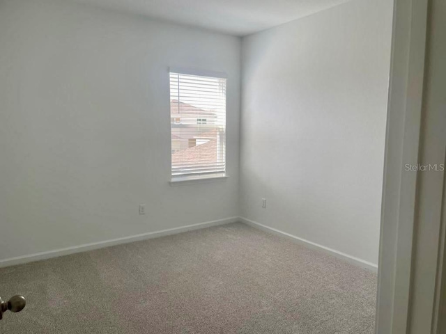 empty room featuring carpet floors