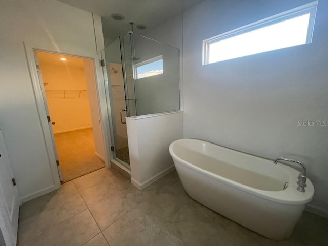 bathroom with shower with separate bathtub