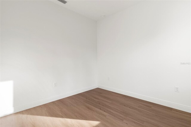 14735 SW 69th Court Rd, Ocala, FL 34473 - unfurnished room featuring wood finished floors and baseboards