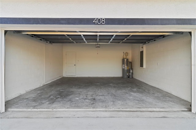 14735 SW 69th Court Rd, Ocala, FL 34473 - garage featuring water heater, electric panel, and concrete block wall