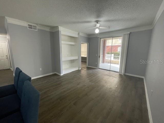 unfurnished living room with ceiling fan, ornamental molding, and dark hardwood / wood-style floors