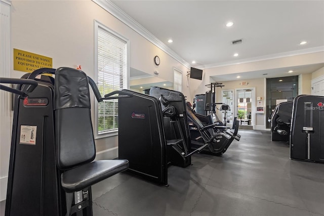 exercise room featuring ornamental molding