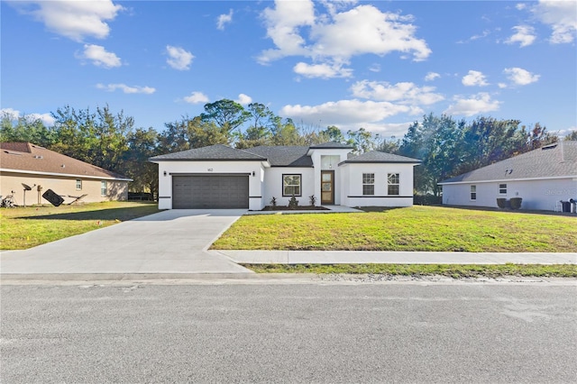 view of front of house with a garage and a front yard